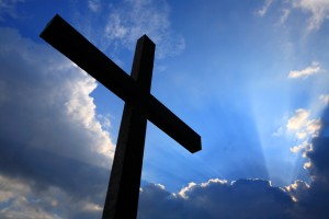 Cross silhouette and the clouds